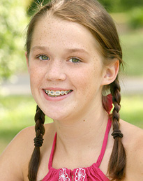 smiling teenage girl with braces